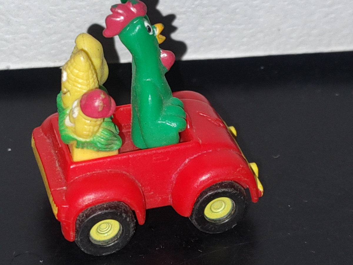 A3- Figurita De Kellogg'S. Cornelio Montado En Carrito Con Mazorcas En La Parte Posterior - 90'S