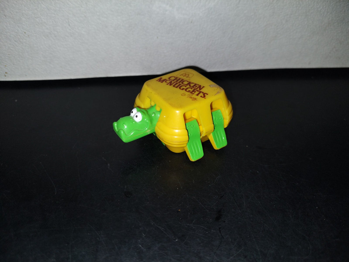 A3- Figura Mcdonald'S. Caja Chicken Mcnuggets. Dinosaurio Transformer - 1990