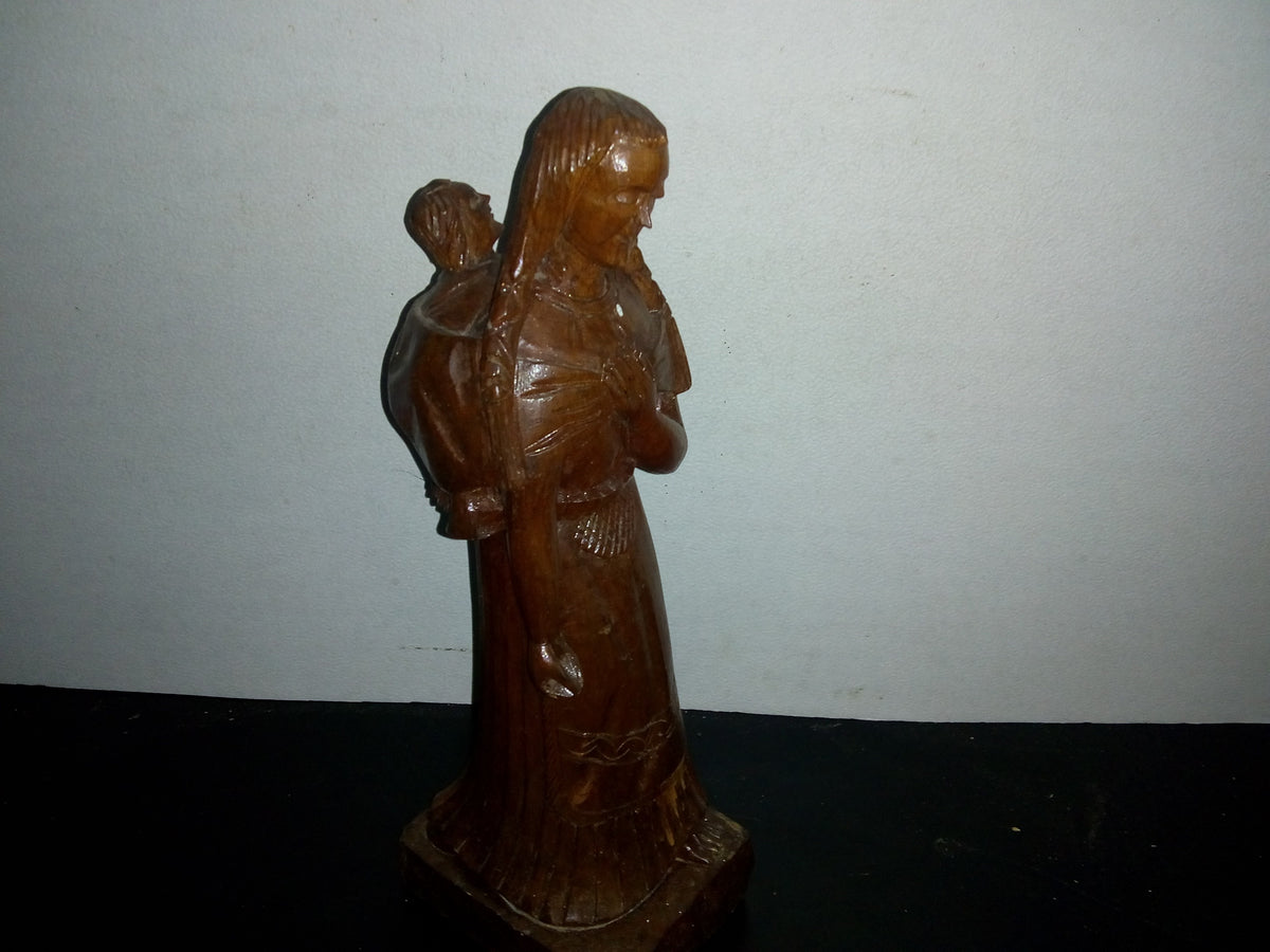 A2- Escultura Tallada En Madera. Mujer Indígena Con Niño En La Espalda - 80's - 90's