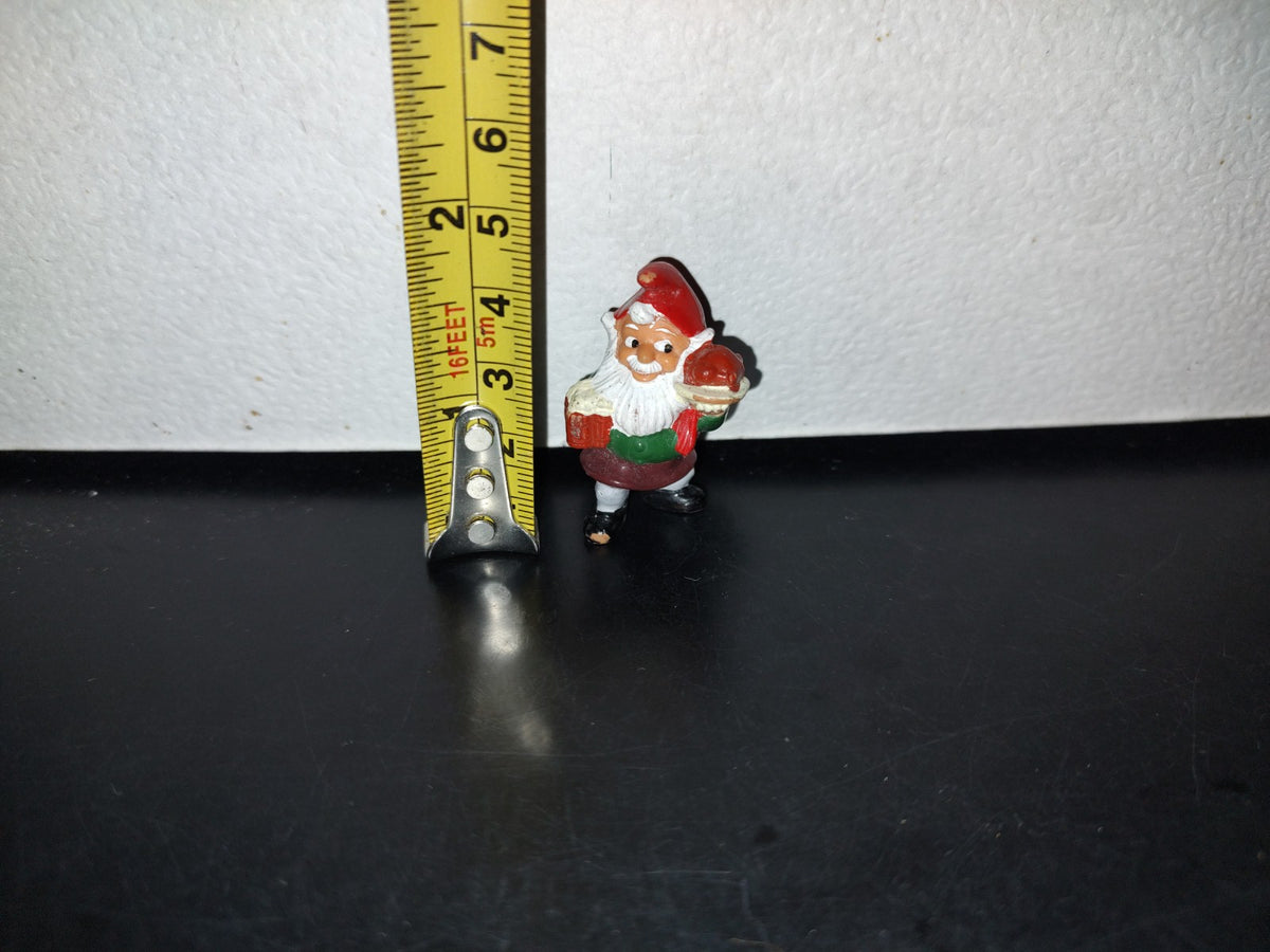 A3- Mini Figurita. Duende Navideño Con Cena En Brazo - 90'S