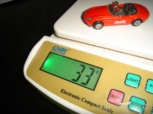 A2- Carrito Con Rotulado De ”Coca Cola” Marca Welly. Bmw Z8
