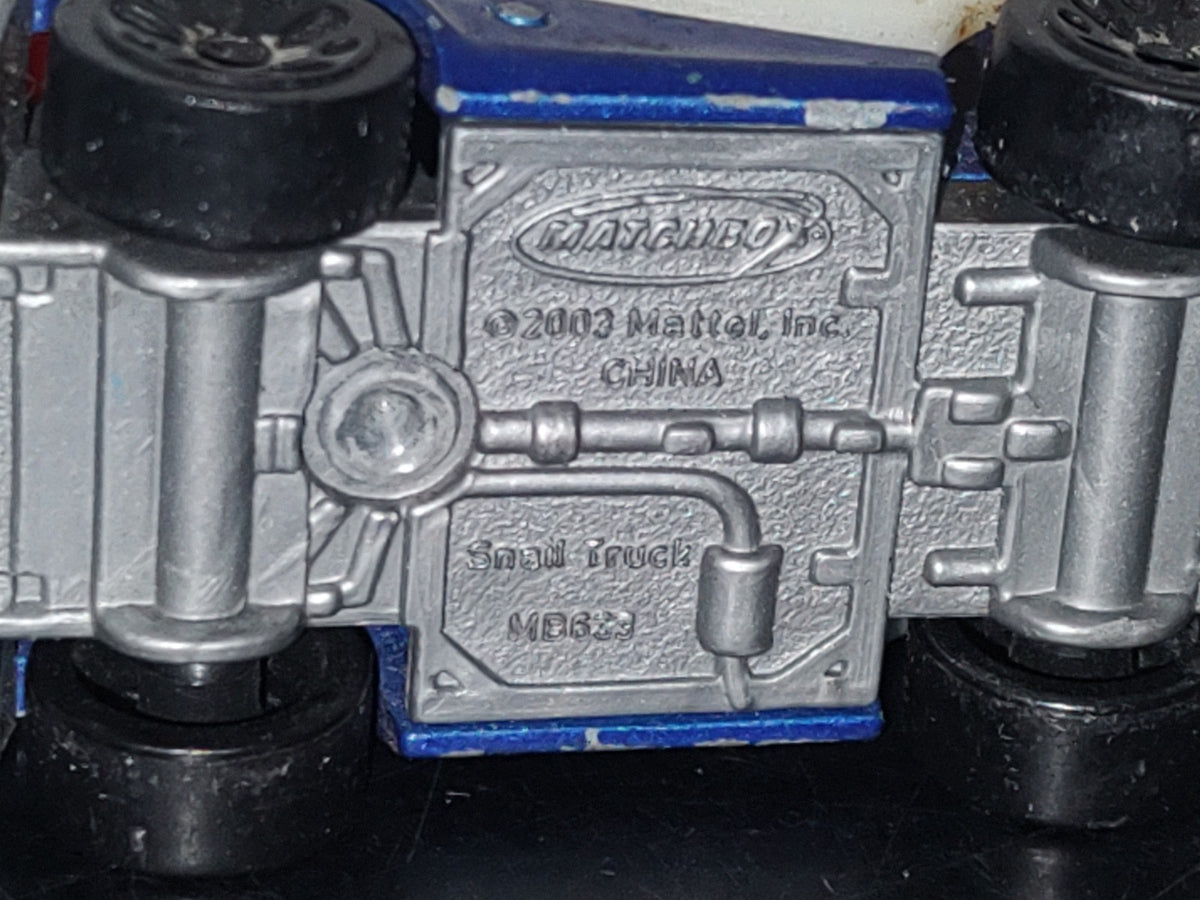 A5- Carrito Matchbox: Snail Truck - 2003 Mattel, Inc.